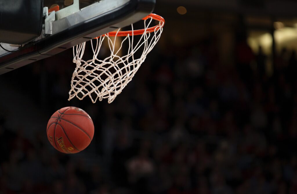 Basketball going through a basketball hoop
